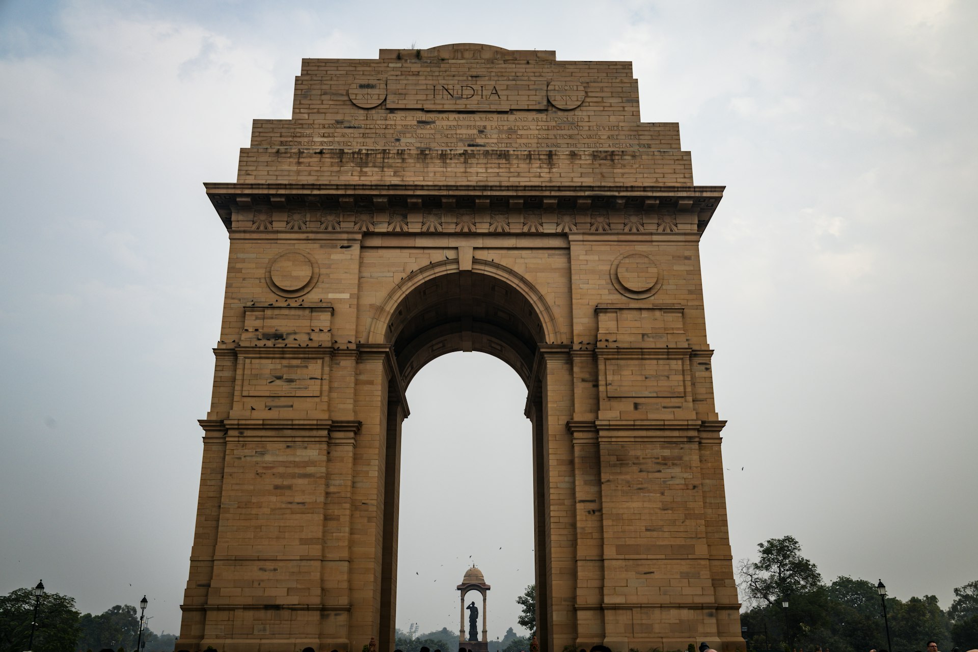 a large stone arch with a clock on it